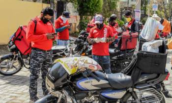 Zomato delivery drivers in March 2020. Female employees have been encouraged to take up to 10 days of /u2018period leave/u2019. Photograph: Narinder Nanu//AFP via Getty Images